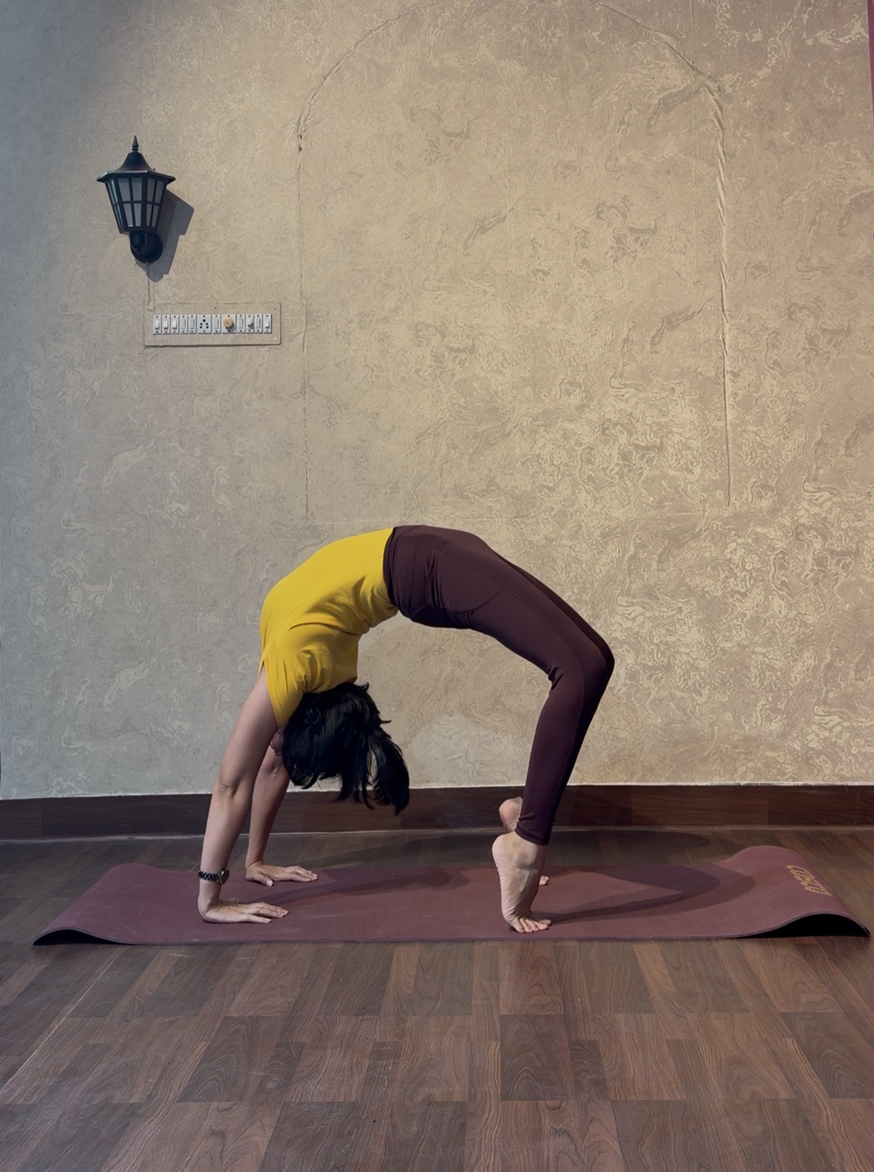 Priya demonstrating Chakrasana